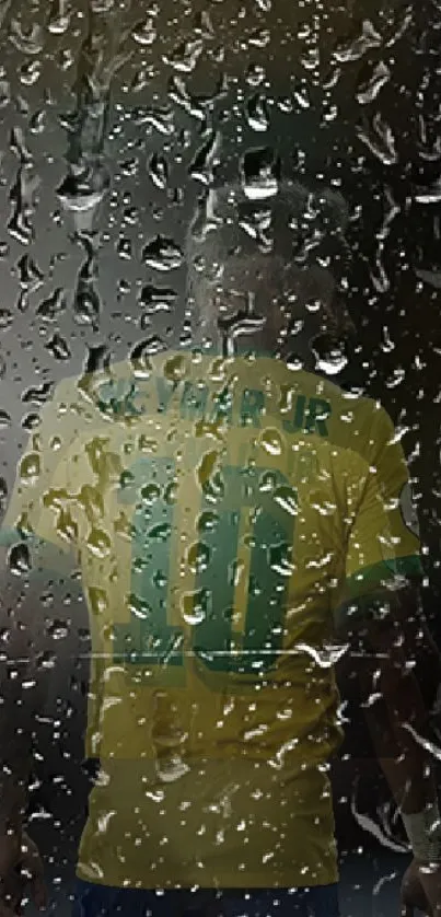 Football player wearing yellow jersey seen through raindrops on glass.