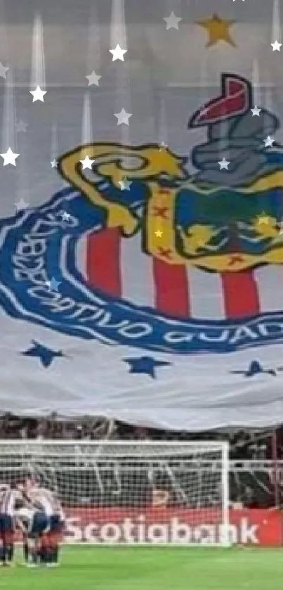 Giant football team banner in stadium with team huddle.