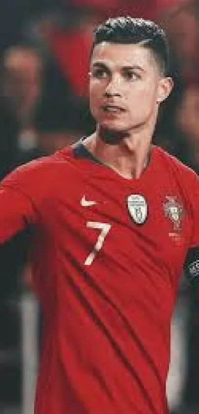 Football player in a red jersey on the field, showing passion and dynamism.