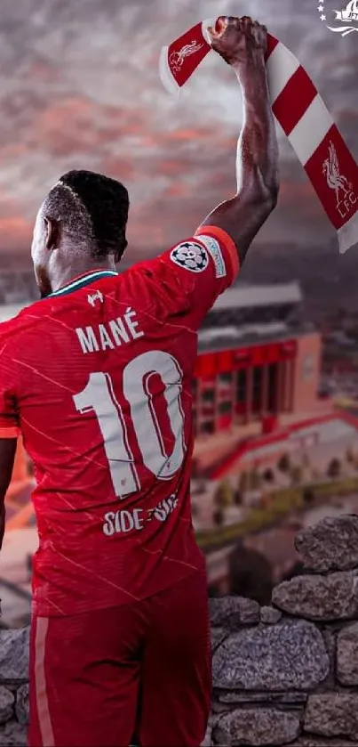 Football player celebrates with scarf overlooking stadium.