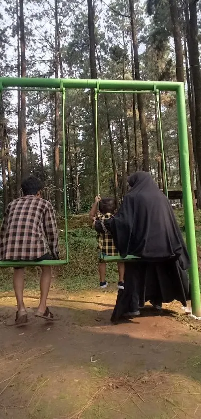 Family enjoying a swing in a forest setting.