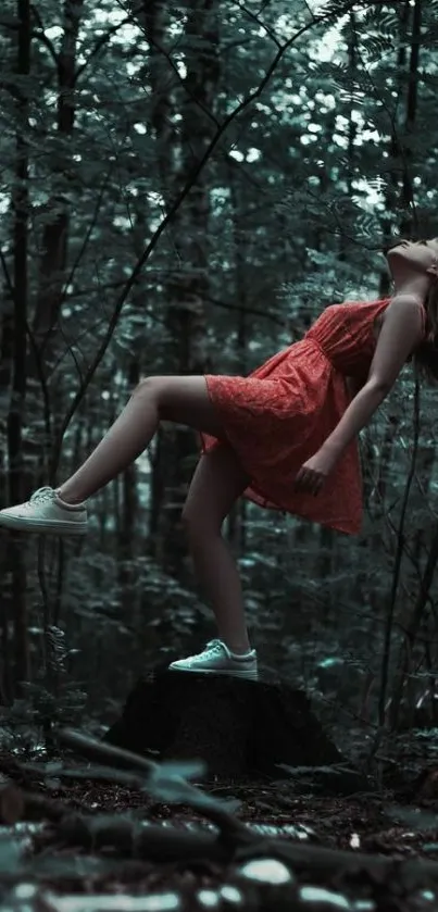 Woman in a red dress in serene forest setting.