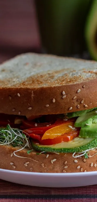 Appetizing avocado sandwich with fresh veggies on a plate.