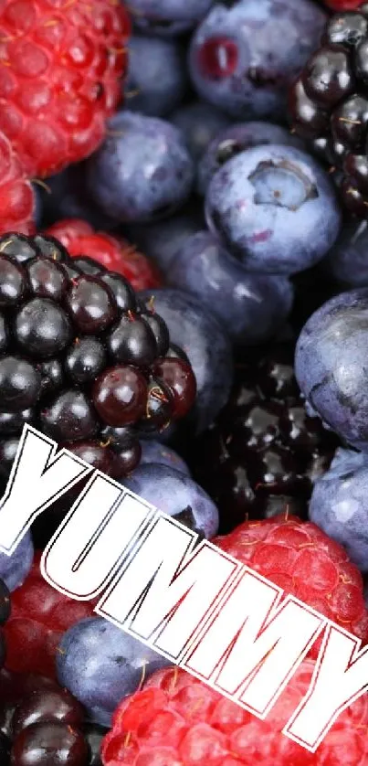 Bright berries with 'Yummy' text wallpaper.