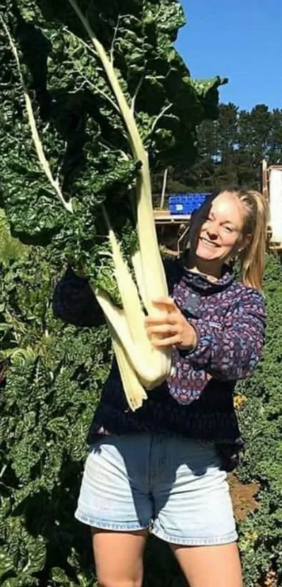 Woman holding large greens in a sunny field