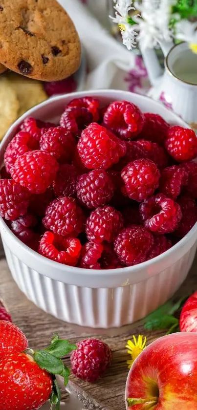 Fresh raspberries in a bowl with cookies and apples, vibrant phone wallpaper.