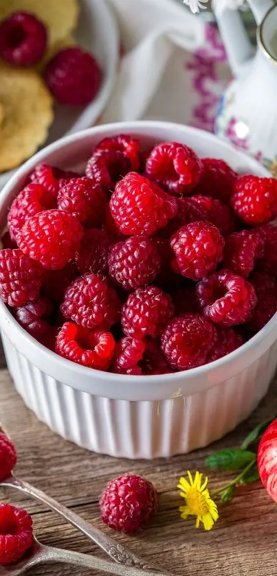 A bowl filled with fresh red raspberries, perfect for a vibrant phone wallpaper.