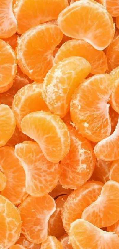 A vibrant wallpaper of fresh tangerine slices in vivid orange tones.