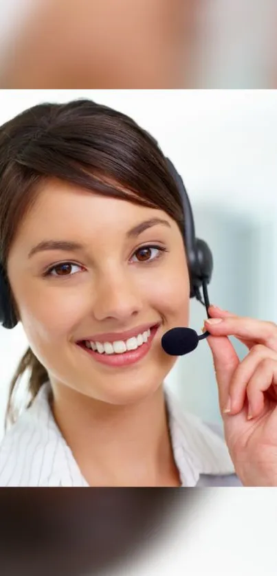 Smiling woman with headset in office setting.