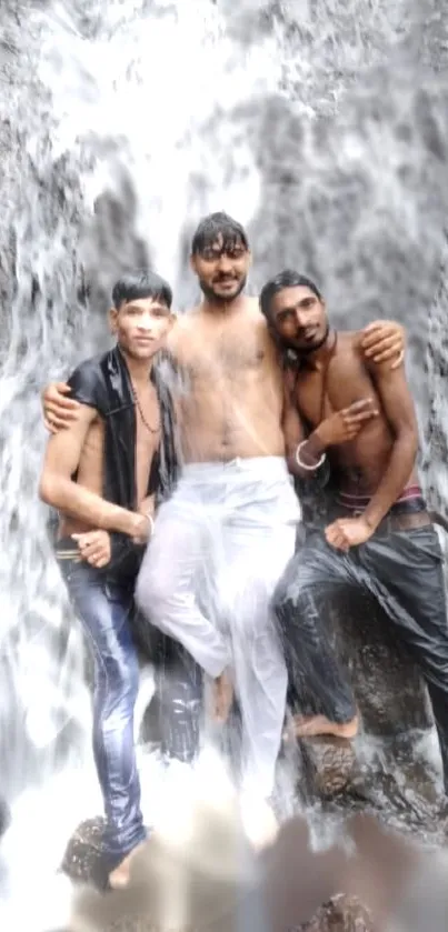 Three friends under a waterfall, enjoying nature.