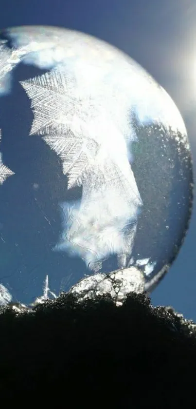 Frosty bubble glistening in sunlight with a clear sky background.