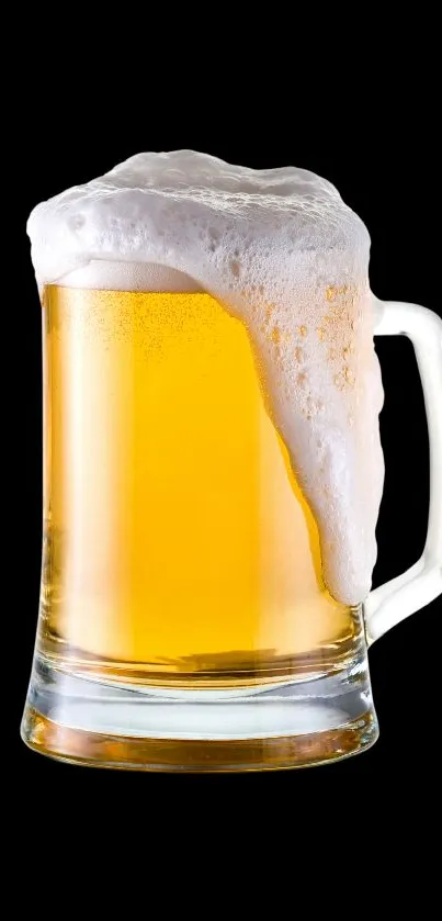 Golden beer mug with frothy top on a black background.