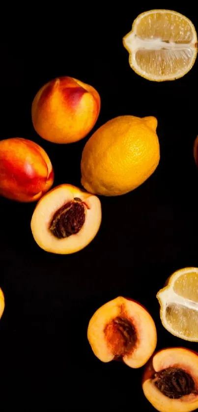 Peaches and lemons arranged on black background wallpaper.