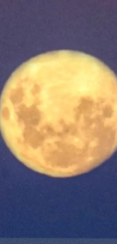 Full moon on a deep blue night sky background.