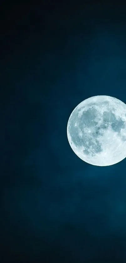 Full moon on a dark blue night sky wallpaper.