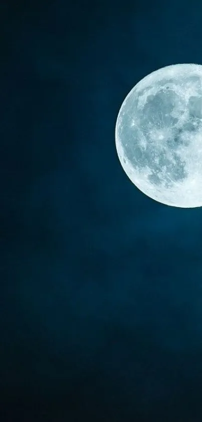 Full moon in a dark blue night sky wallpaper.