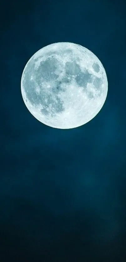 Full moon illuminating a dark blue night sky, creating a moody atmosphere.