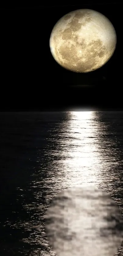 Full moon reflecting over the ocean at night.