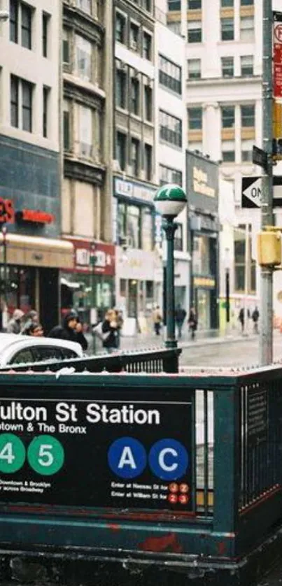 Fulton St Station entrance in New York City with urban street view.