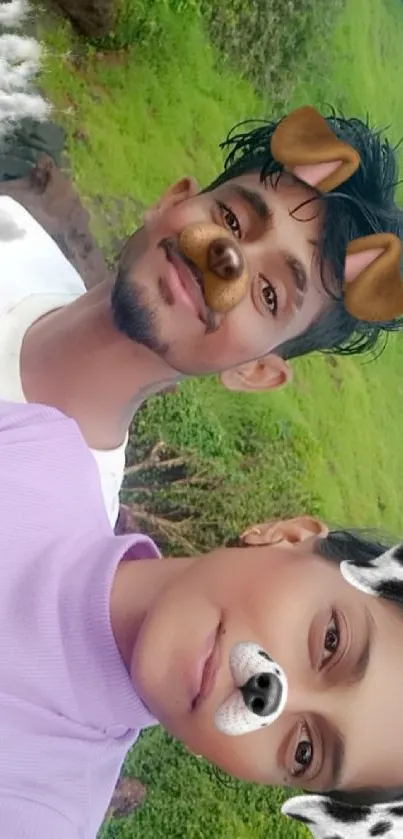 Cheerful selfie with dog filters in a green landscape.