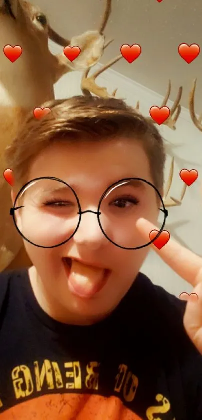Playful selfie with fun filters and heart decorations.