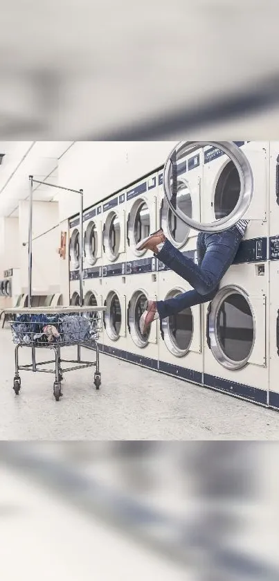 Person hanging out of a washing machine in a laundromat with a playful style.