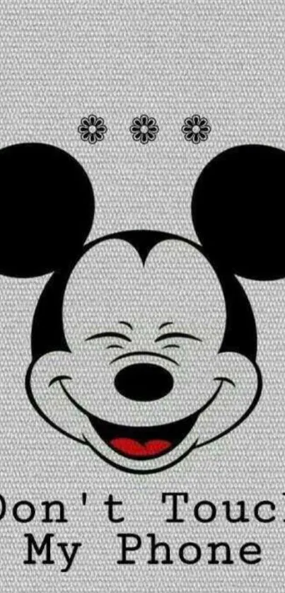 Mickey Mouse wallpaper with playful warning message.