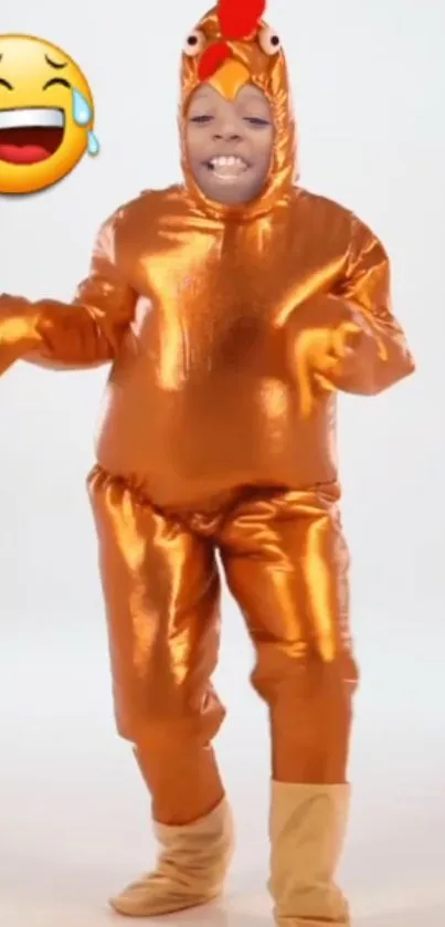 Person in orange chicken costume with laughing emoji.