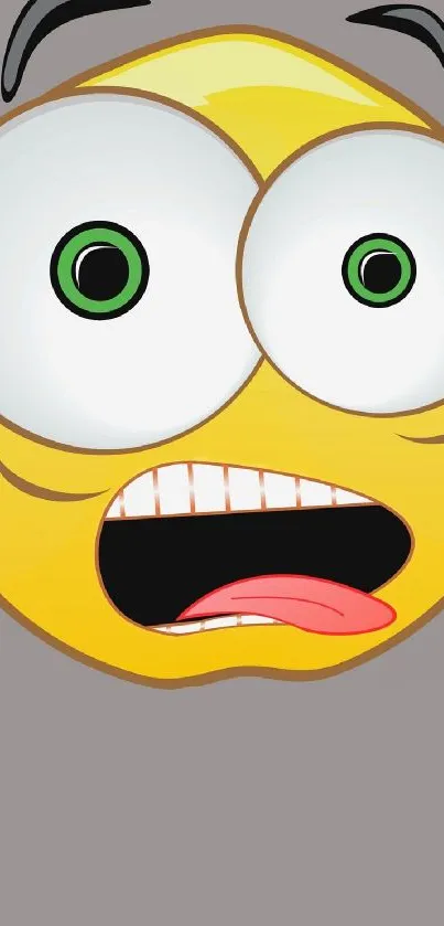 Funny yellow emoji with wide eyes and a playful expression on gray background.