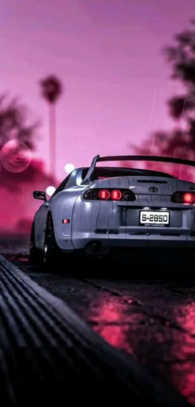 A sleek car on a wet street with pink hues at night.