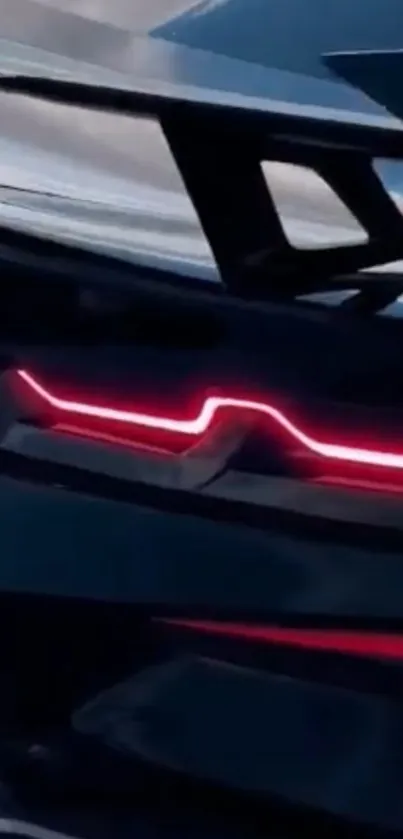 Futuristic car tail lights on a sleek, dark wallpaper background.