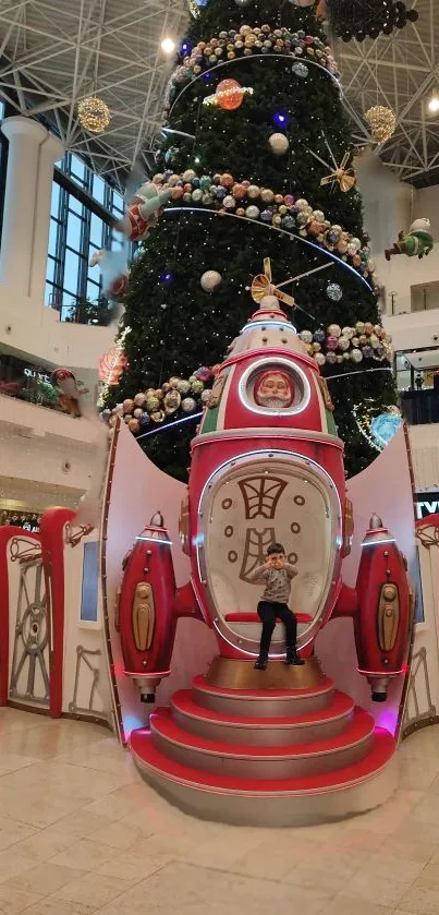 Rocket and Christmas tree display in mall.