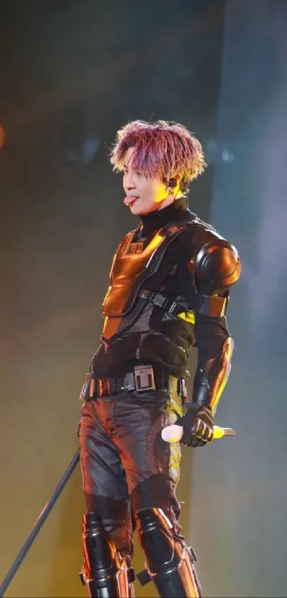 Futuristic performer in sleek armor on stage with vivid lights.