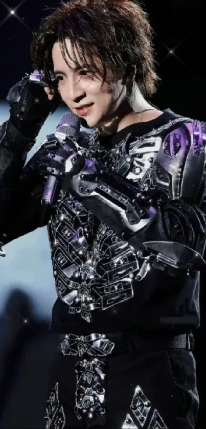 Futuristic performer in metallic armor on cosmic stage backdrop.