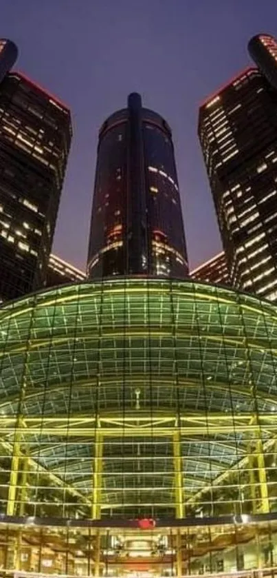 Futuristic skyscrapers illuminated at night, showcasing modern architecture.