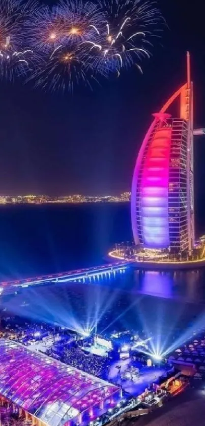 Burj Al Arab lit up at night with fireworks in the Dubai skyline.