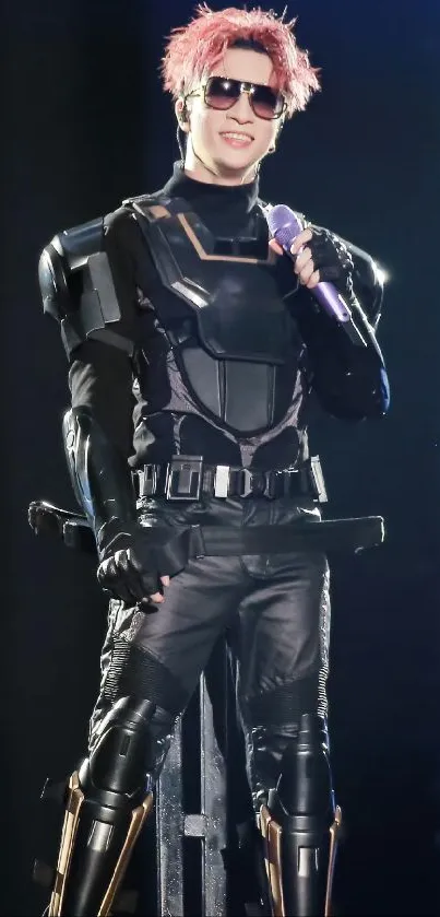 Performer in black armor with sunglasses.