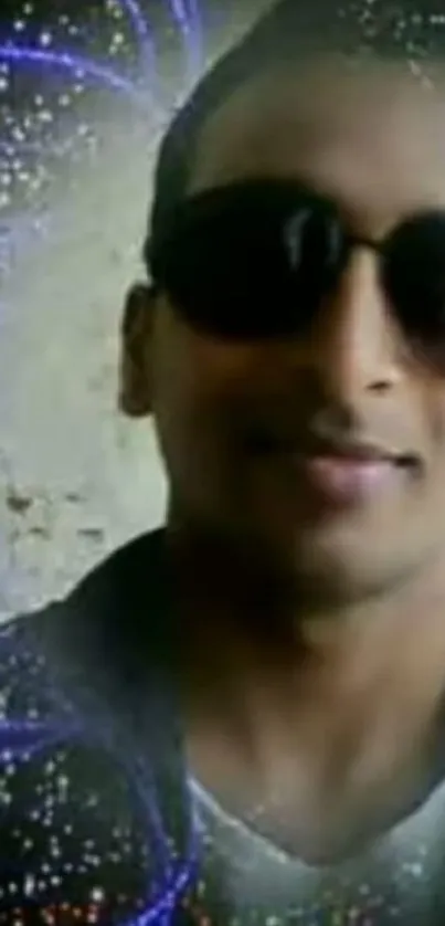 A person wearing sunglasses with a cosmic, abstract background.