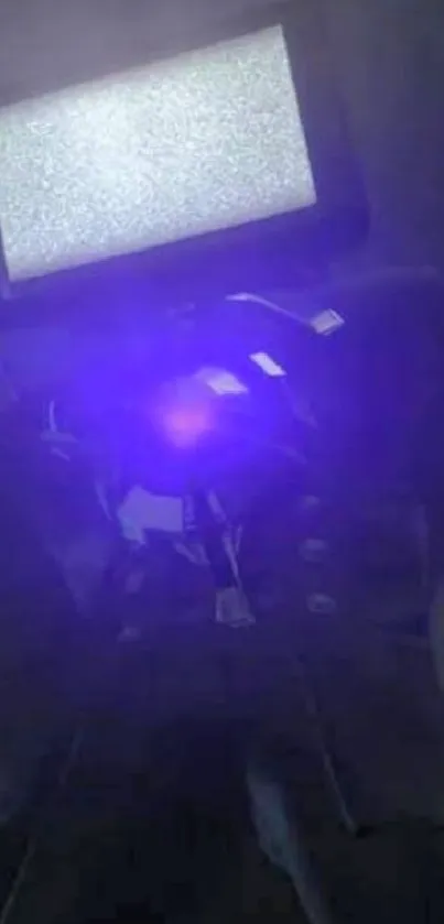 Futuristic robot with TV head and dark blue glow.