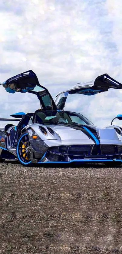 Futuristic sports car with gull-wing doors on asphalt.