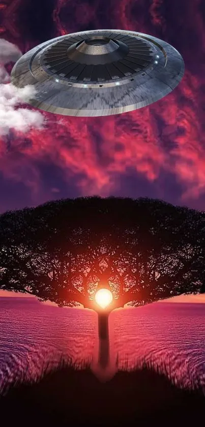 Mobile wallpaper of a silhouetted tree against a sunset with a UFO in the sky.