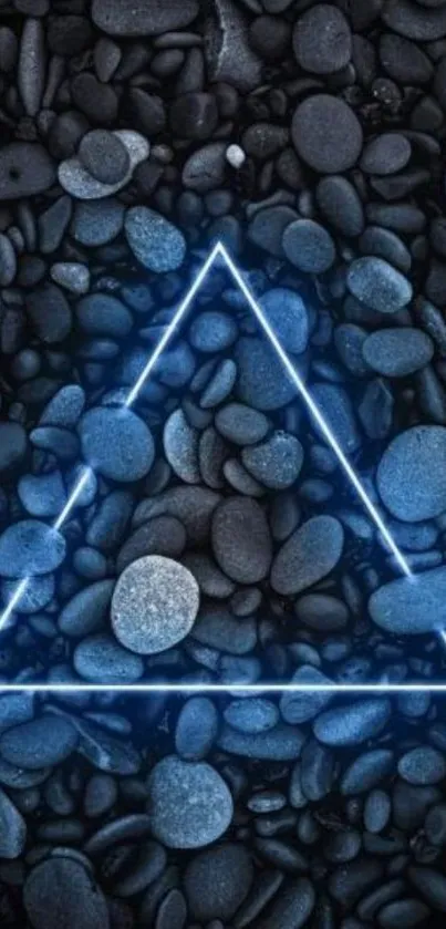 Glowing blue triangle on dark pebbles wallpaper.