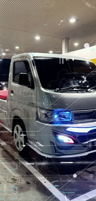 Futuristic truck with lights at a modern gas station.