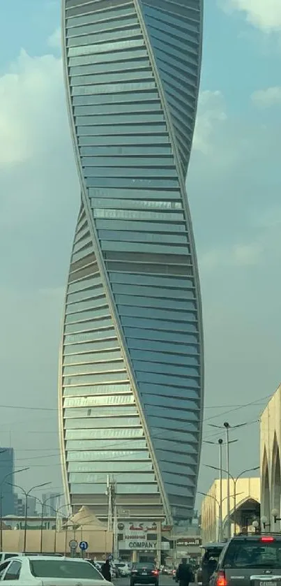 Twisting skyscraper under blue sky in cityscape background.