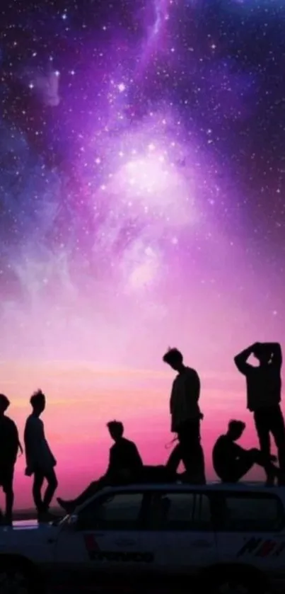 Group silhouette against a cosmic purple sky with stars.