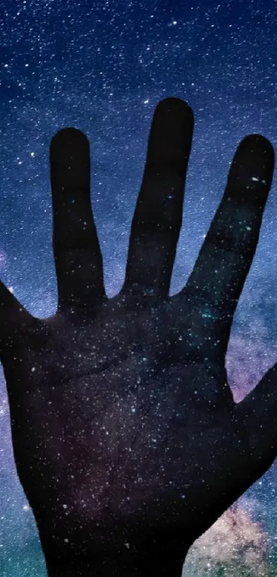 A hand silhouette set against a galaxy full of stars in the night sky wallpaper.