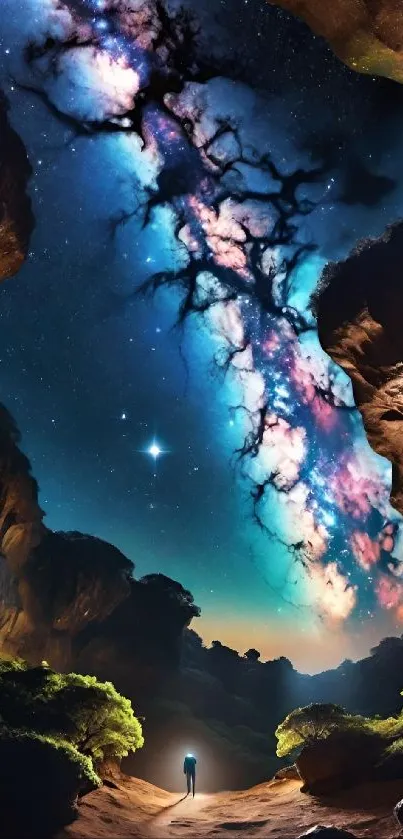 Person gazing at a vivid galaxy in a rocky landscape.