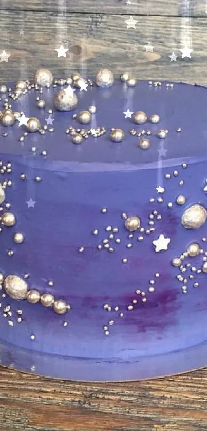 A beautifully decorated galaxy-themed cake with metallic accents and purple icing.