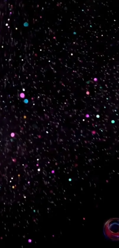 Colorful galaxy sprinkle wallpaper with vibrant dots on a black background.