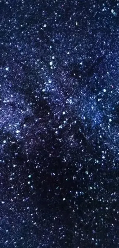 Beautiful galaxy with countless stars in deep midnight blue tones.